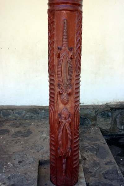Wood carved pillars on front of church